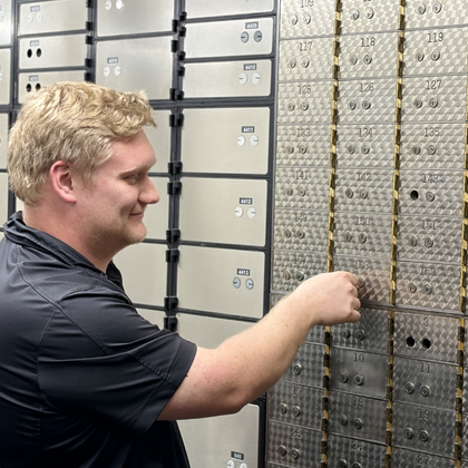 banker helping with safe deposit box