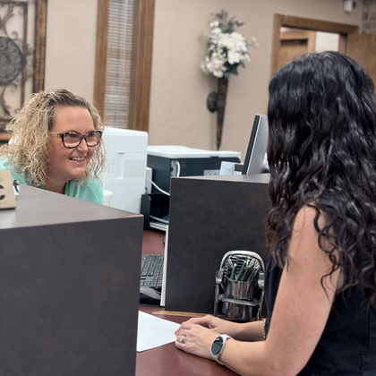 teller helping customer